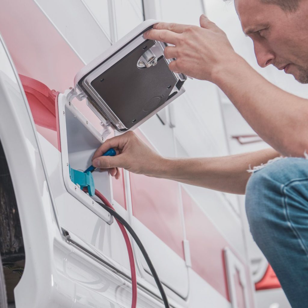 man checking RV battery 